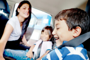 parent with kids in car